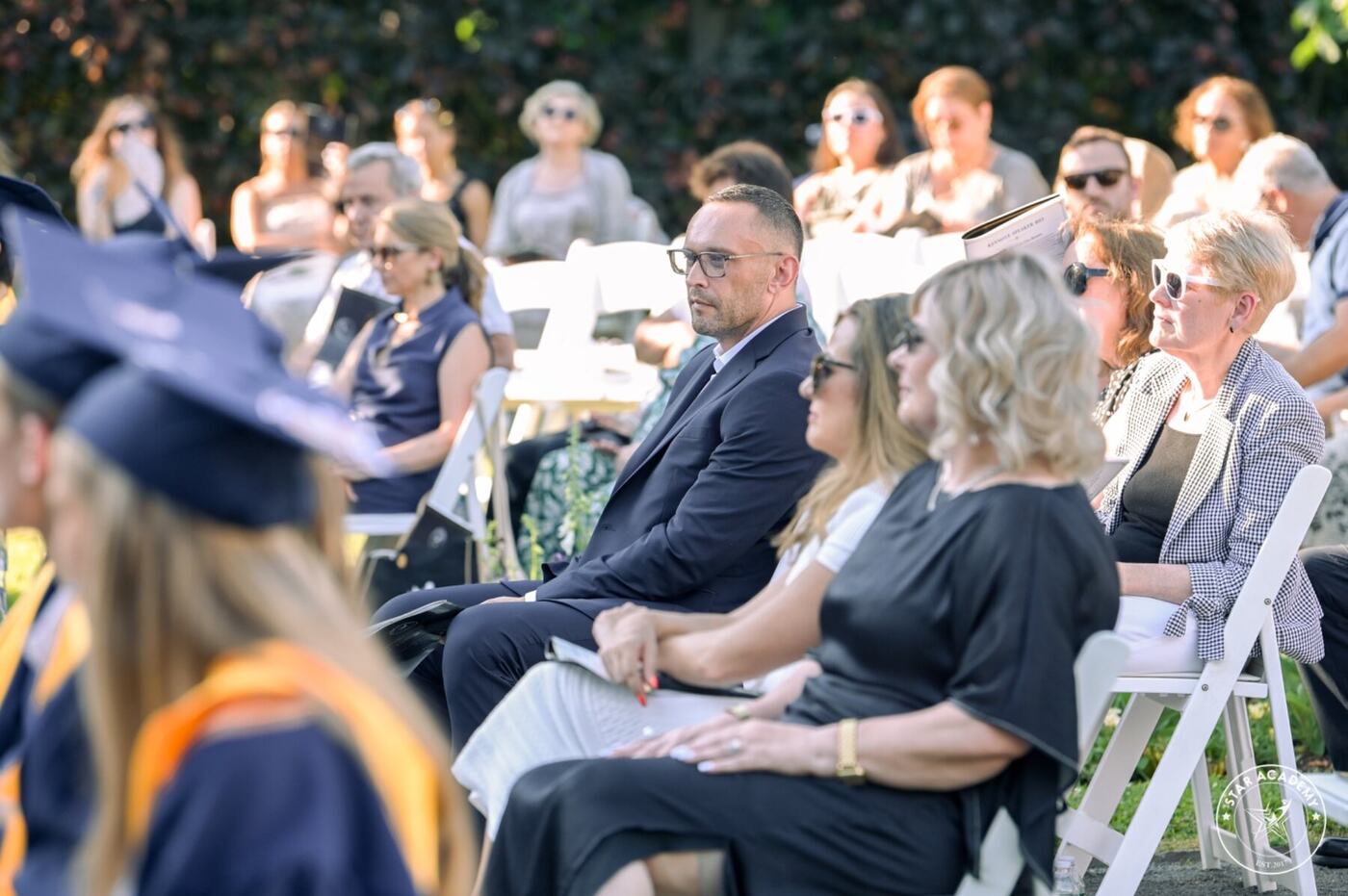 Guests watching the graduation ceremony