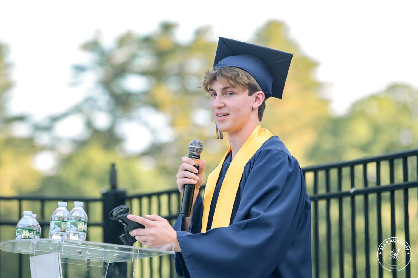 Graduate speaking at commencement