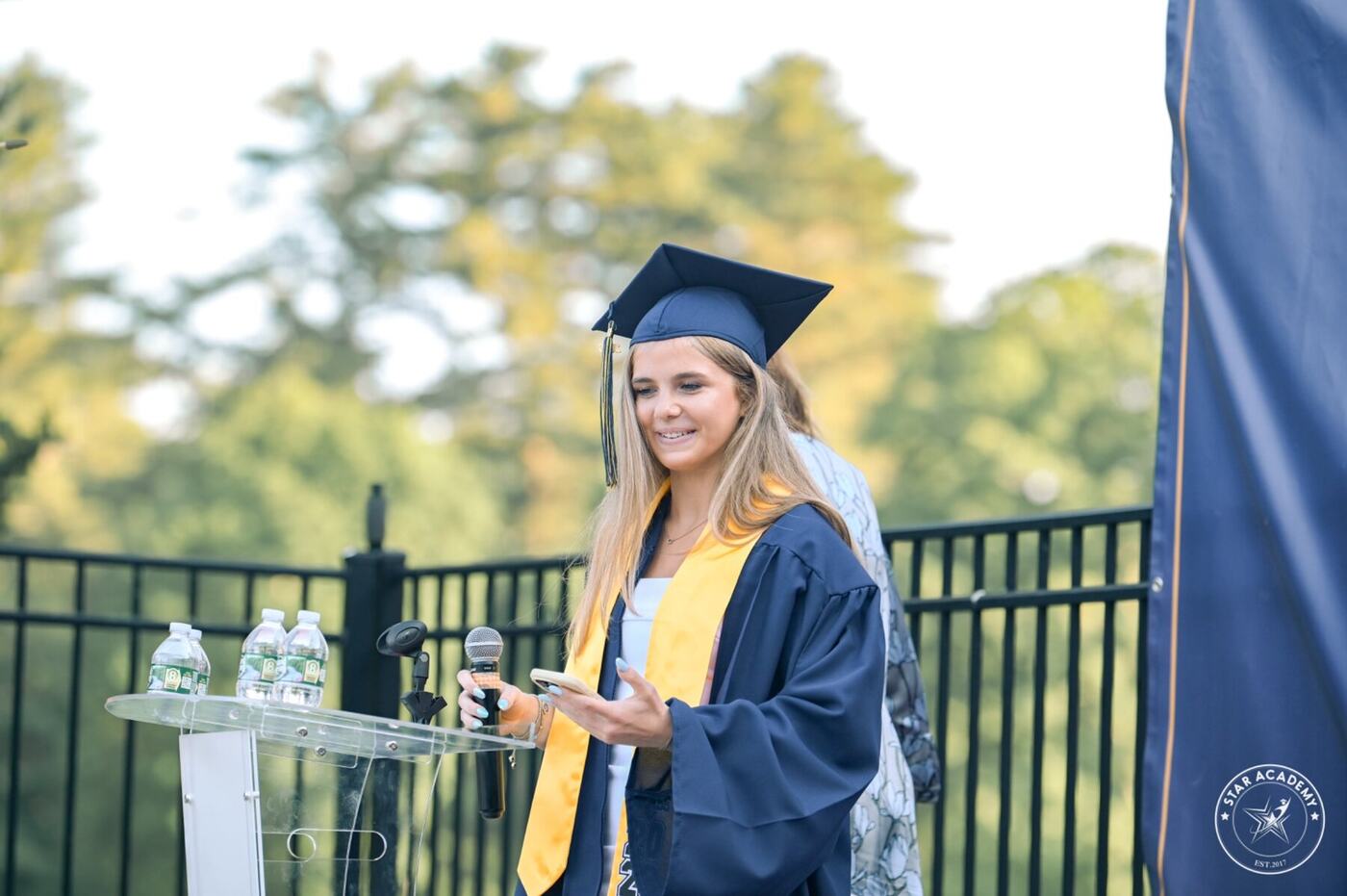 Graduate addressing the audience